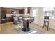 Kitchen with dark cabinets, glass-top stove, and island at 2070 Bonny Glen Cir, Austell, GA 30106