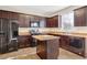 Modern kitchen with dark wood cabinets and an island at 2070 Bonny Glen Cir, Austell, GA 30106