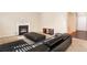 Living room with a fireplace, sectional sofa, and ottoman at 2070 Bonny Glen Cir, Austell, GA 30106