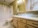 Bathroom with shower, toilet, and updated vanity at 2504 Kingsglen Ct, Dunwoody, GA 30360