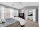 Main bedroom with ensuite bathroom and carpeted floors at 5565 Trace Views Dr, Norcross, GA 30071