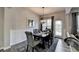 Bright dining room features a dark wood table, six chairs, and a chandelier at 1527 Landmark Ln, Cumming, GA 30040