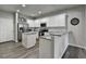 Modern kitchen with granite countertops, white cabinets, and stainless steel appliances at 1527 Landmark Ln, Cumming, GA 30040