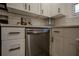 Stainless steel dishwasher in a modern kitchen with white shaker cabinets at 2173 Cloverdale Se Dr, Atlanta, GA 30316