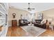 Relaxing bonus room with hardwood floors, leather couches, and built-in shelving at 2773 Carillon Xing, Marietta, GA 30066