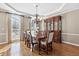 Elegant dining room with hardwood floors, a chandelier, and built-in hutch at 2773 Carillon Xing, Marietta, GA 30066