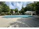 Community pool with a pool house and safety cover at 4130 Royal Regency Nw Cir # 3, Kennesaw, GA 30144