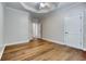 Spacious bedroom featuring hardwood floors and neutral walls at 490 Revenna Trl, Fayetteville, GA 30214