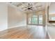 Spacious living area with hardwood floors, high ceilings, and large windows at 490 Revenna Trl, Fayetteville, GA 30214