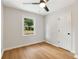 Bedroom with wood-look floors, ceiling fan, and window at 2089 Bluffton Way, Decatur, GA 30035