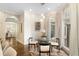 Breakfast nook with a round glass table, modern chairs, and large window at 2753 Pinebloom Way, Duluth, GA 30097