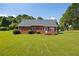 Brick home with deck and expansive grassy backyard at 1580 Bethel Church Rd, Hiram, GA 30141