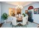 Elegant dining room with round wooden table and upholstered chairs at 405 Laurel Spring Ct, Canton, GA 30114