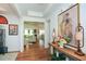 Bright and spacious entryway with hardwood floors and decorative console table at 405 Laurel Spring Ct, Canton, GA 30114