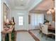 Bright and spacious entryway with hardwood floors and decorative console table at 405 Laurel Spring Ct, Canton, GA 30114