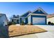 Charming blue home with white accents and a two-car garage at 405 Laurel Spring Ct, Canton, GA 30114
