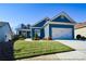 Charming blue home with white accents and a two-car garage at 405 Laurel Spring Ct, Canton, GA 30114
