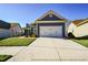 Charming blue home with white accents and a two-car garage at 405 Laurel Spring Ct, Canton, GA 30114