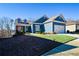 Charming blue home with white accents and a two-car garage at 405 Laurel Spring Ct, Canton, GA 30114