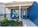 Inviting front porch with striped chairs and a floral rug at 405 Laurel Spring Ct, Canton, GA 30114