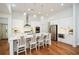 Modern kitchen with white cabinets, stainless steel appliances, and an island at 405 Laurel Spring Ct, Canton, GA 30114