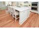 Kitchen island with white quartz countertop and hardwood floors at 405 Laurel Spring Ct, Canton, GA 30114