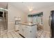 Kitchen with island, wood cabinets, and breakfast nook at 84 Jousters Ln, Lawrenceville, GA 30044