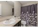 Clean bathroom with shower/tub and floral curtain at 207 Cross Rd, Acworth, GA 30102