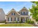 Two-story house with neutral siding, landscaping, and a covered porch at 207 Cross Rd, Acworth, GA 30102