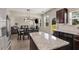 Open concept kitchen with island and view into living room at 207 Cross Rd, Acworth, GA 30102