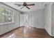 Bright bedroom featuring hardwood floors and built-in closets at 3797 Peachtree Dunwoody Ne Rd, Atlanta, GA 30342