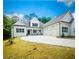 New construction home with a three-car garage and a spacious driveway at 101 Forsyth Park Ln, Woodstock, GA 30188