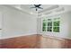 Main bedroom with hardwood floors and access to the ensuite bathroom at 101 Forsyth Park Ln, Woodstock, GA 30188