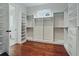 Custom-designed walk-in closet offering extensive storage at 101 Forsyth Park Ln, Woodstock, GA 30188