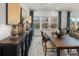 Bright dining room with large windows and wooden table at 190 Hickory Bluffs Pkwy, Canton, GA 30114