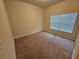 Spacious bedroom with carpeted floor and window at 1580 Culpepper Ln, Mcdonough, GA 30253