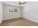 Well-lit bedroom with hardwood floors and ceiling fan at 6684 Birch Rd, Winston, GA 30187