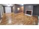 Spacious living room with hardwood floors and a fireplace at 240 Knob Dr, Carrollton, GA 30116