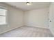 Cozy bedroom with carpet, neutral walls and a window at 11643 Stovall Pl, Hampton, GA 30228