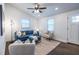 Modern living room with blue sofa and hardwood floors at 116 Turman Se Ave, Atlanta, GA 30315