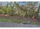 Landscaped backyard with mature trees and a fence at 320 3Rd Ne St # 1, Atlanta, GA 30308