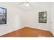 Bright bedroom with hardwood floors and two windows at 320 3Rd Ne St # 1, Atlanta, GA 30308