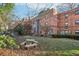 Brick building with a courtyard featuring a picnic table at 320 3Rd Ne St # 1, Atlanta, GA 30308