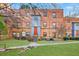 Brick building with red door and grassy area at 320 3Rd Ne St # 1, Atlanta, GA 30308