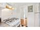 White kitchen with gas stove and black countertops at 320 3Rd Ne St # 1, Atlanta, GA 30308