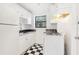 White kitchen with black countertops and appliances at 320 3Rd Ne St # 1, Atlanta, GA 30308