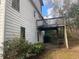 Elevated wooden deck with stairs leading to the backyard at 4382 Oakleaf Cv, Decatur, GA 30034