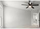 Bedroom with ceiling fan and access to hallway at 1139 Hembree Ln, Austell, GA 30168