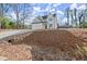 Two story house with driveway and landscaped yard at 1139 Hembree Ln, Austell, GA 30168