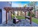 Relaxing patio area with pergola, seating, and fire pit at 310 Melissa Way, Atlanta, GA 30349